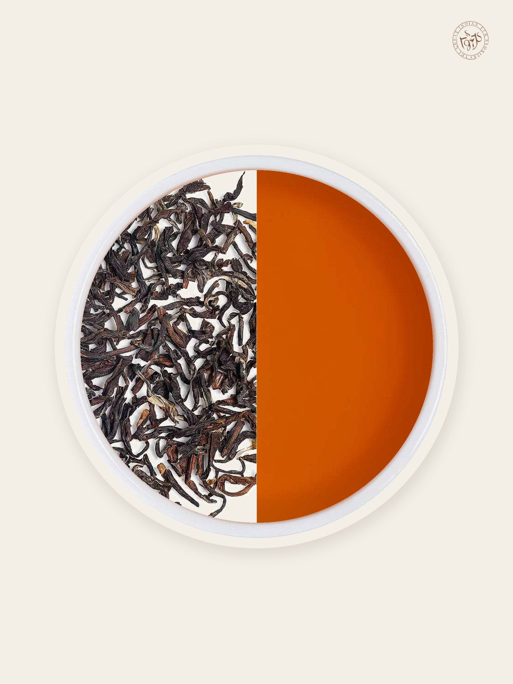 Darjeeling Second Flush loose tea leaves with warm amber tea liquor